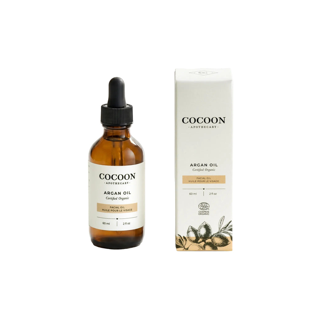 Oh Canada Gifts Cocoon Apothecary organic argan facial oil in an amber glass dropper bottle with matching product box.