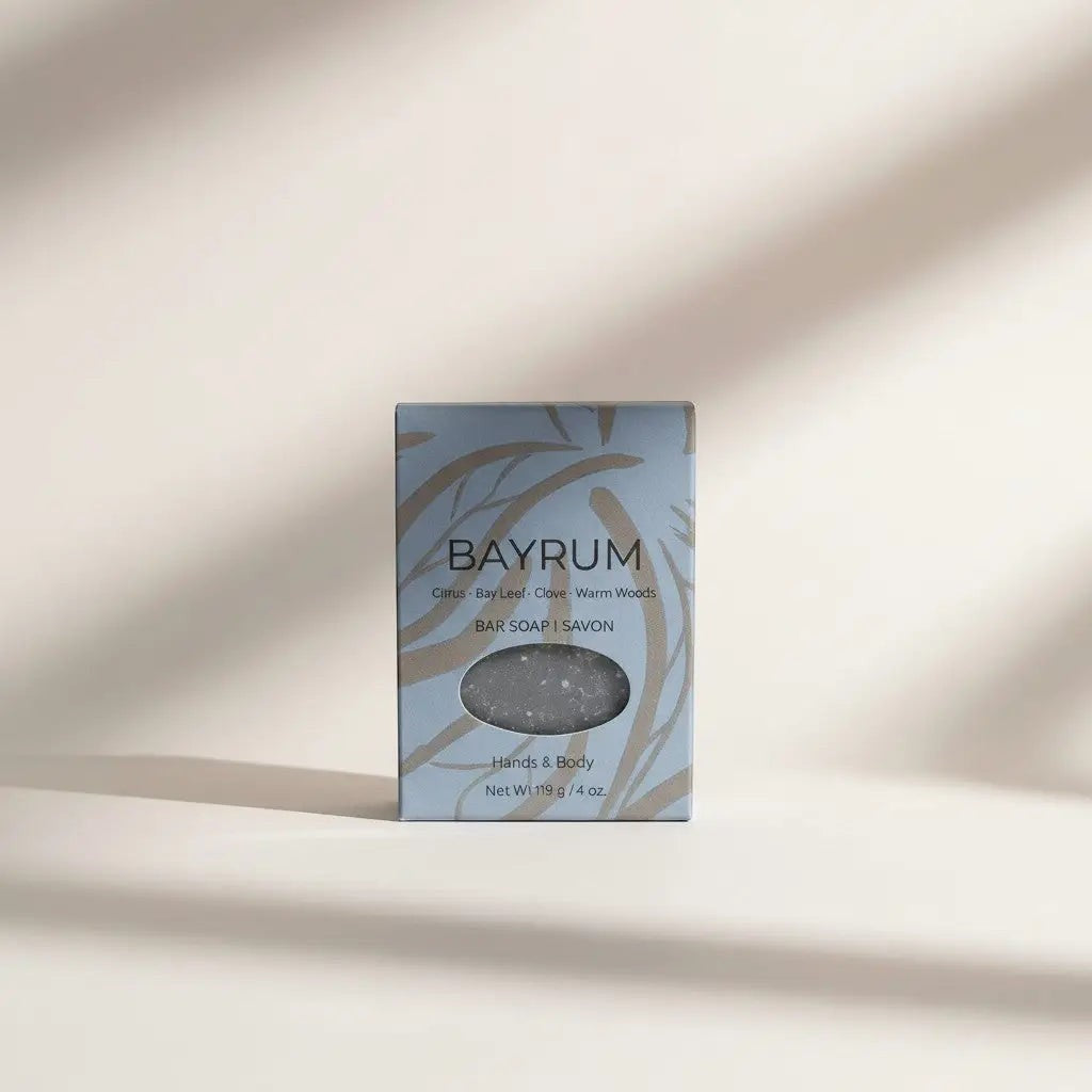 Oh Canada Gifts Bay Rum soap bar in light blue packaging with botanical leaf patterns and a circular cutout