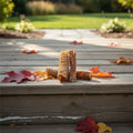 Oh Canada Gifts 6-inch natural air-dried beef trachea dog chews on a wooden deck with autumn leaves