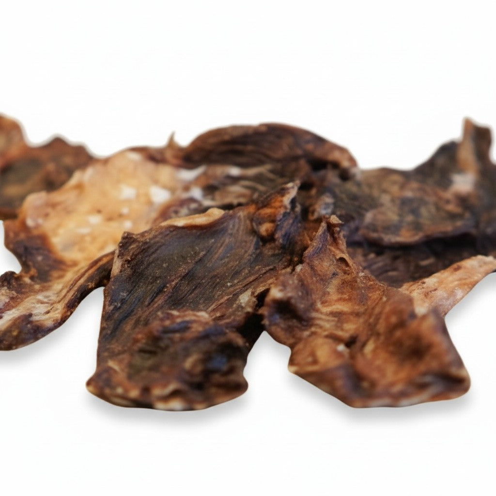 Oh Canada Gifts slow-cooked Canadian bison jerky dog treats with a chewy texture on a white background