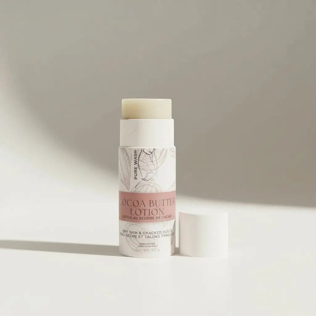 Oh Canada Gifts Pure Wash cocoa butter lotion stick in a white twist-up tube for dry skin and cracked heels.