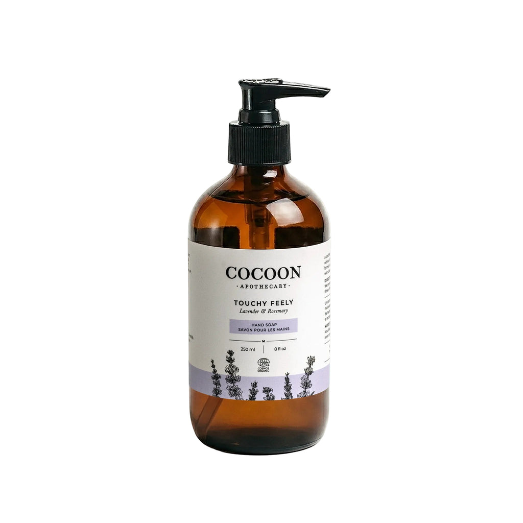 Oh Canada Gifts Cocoon Apothecary Touchy Feely organic liquid hand soap in an amber glass bottle with a pump dispenser.