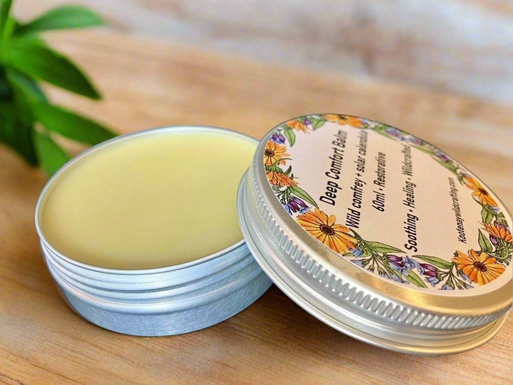 Oh Canada Gifts Deep Comfort comfrey and calendula herbal healing balm in a round metal tin with floral label.
