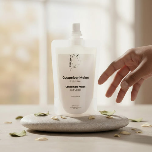 Oh Canada Gifts cucumber melon body lotion in a 100ml eco-friendly refill pouch resting on a stone with dried leaves.