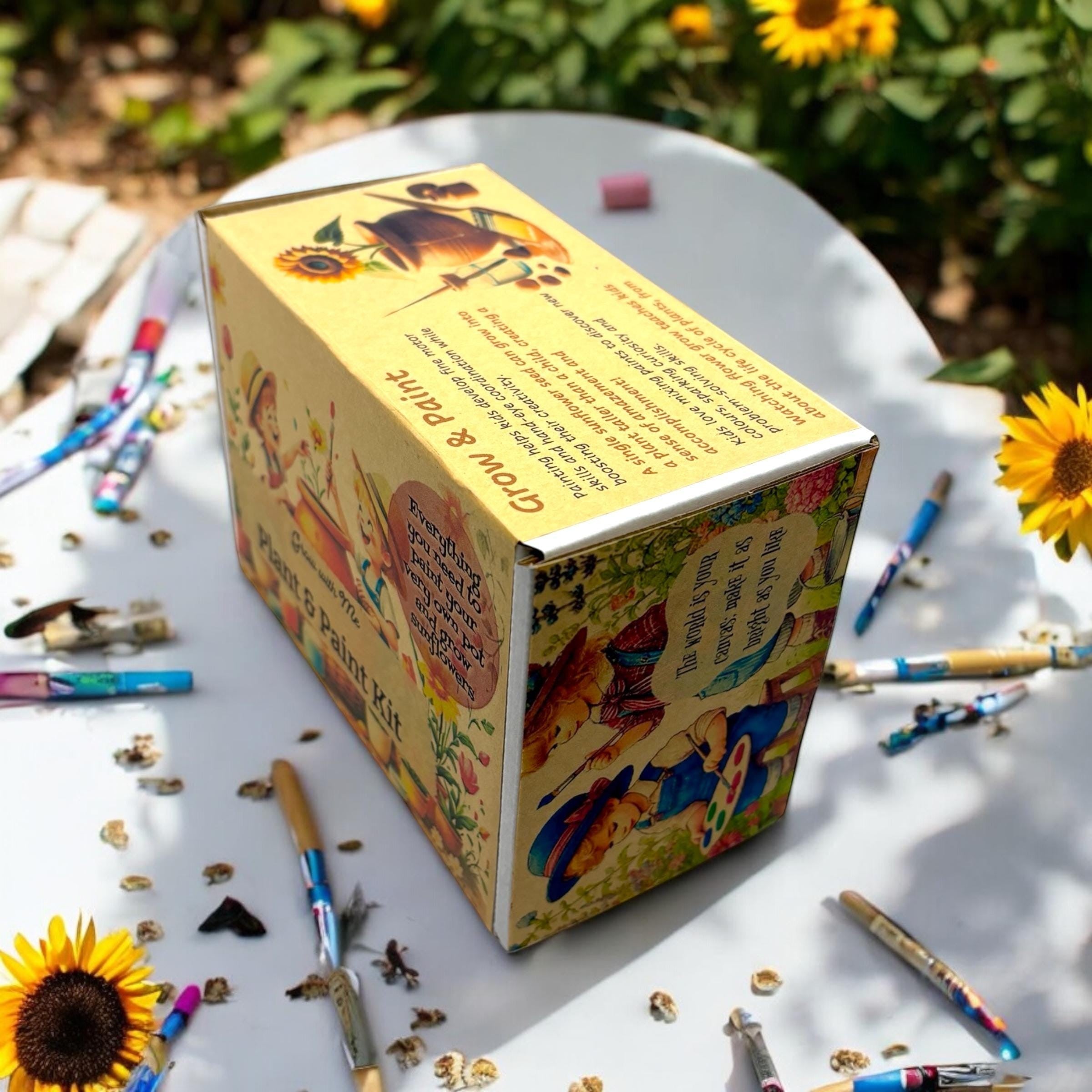 Oh Canada Gifts Paint, Plant & Grow DIY kit box with painting supplies and sunflowers on a white table outdoors