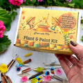 Oh Canada Gifts Paint, Plant & Grow DIY kit box featuring illustrated children painting a sunflower clay pot.