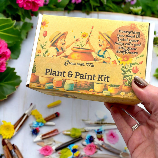 Oh Canada Gifts Paint, Plant & Grow DIY kit box featuring illustrated children painting a sunflower clay pot.
