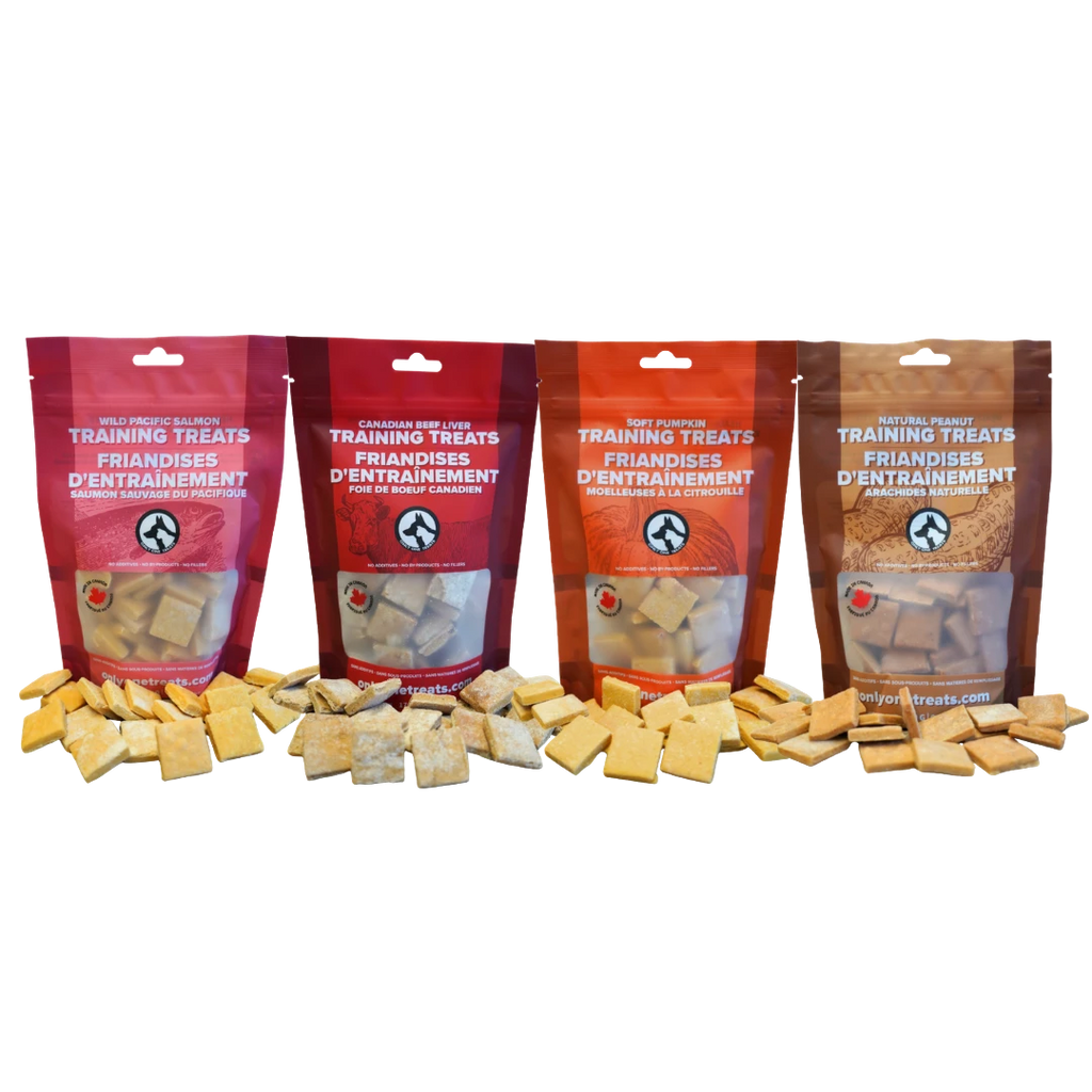 Oh Canada Gifts training treat variety box featuring four bags of soft salmon, beef, pumpkin, and peanut dog treats.