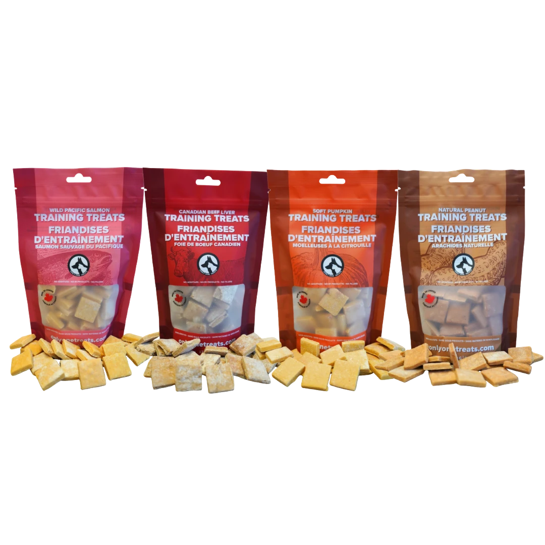 Oh Canada Gifts training treat variety box featuring four bags of soft salmon, beef, pumpkin, and peanut dog treats.