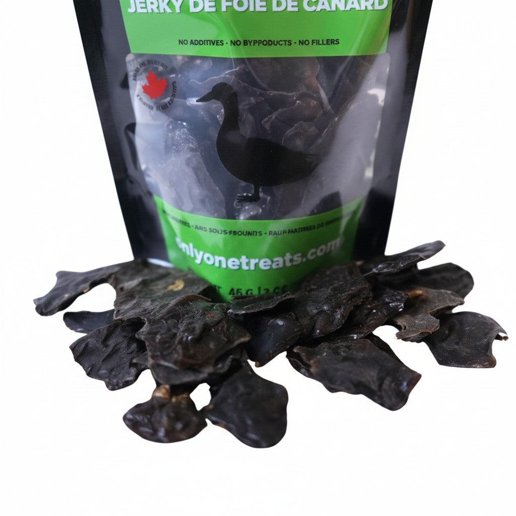 Oh Canada Gifts duck liver jerky dog treats in a black and green pouch with pieces of dried liver in front.
