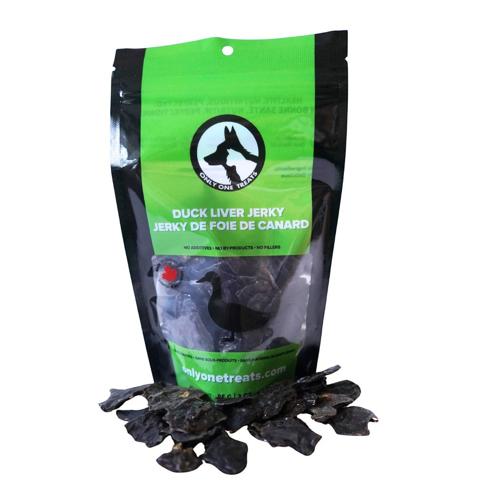 Oh Canada Gifts duck liver jerky dog treats in a black and green 85g bag with pieces of dried liver in front
