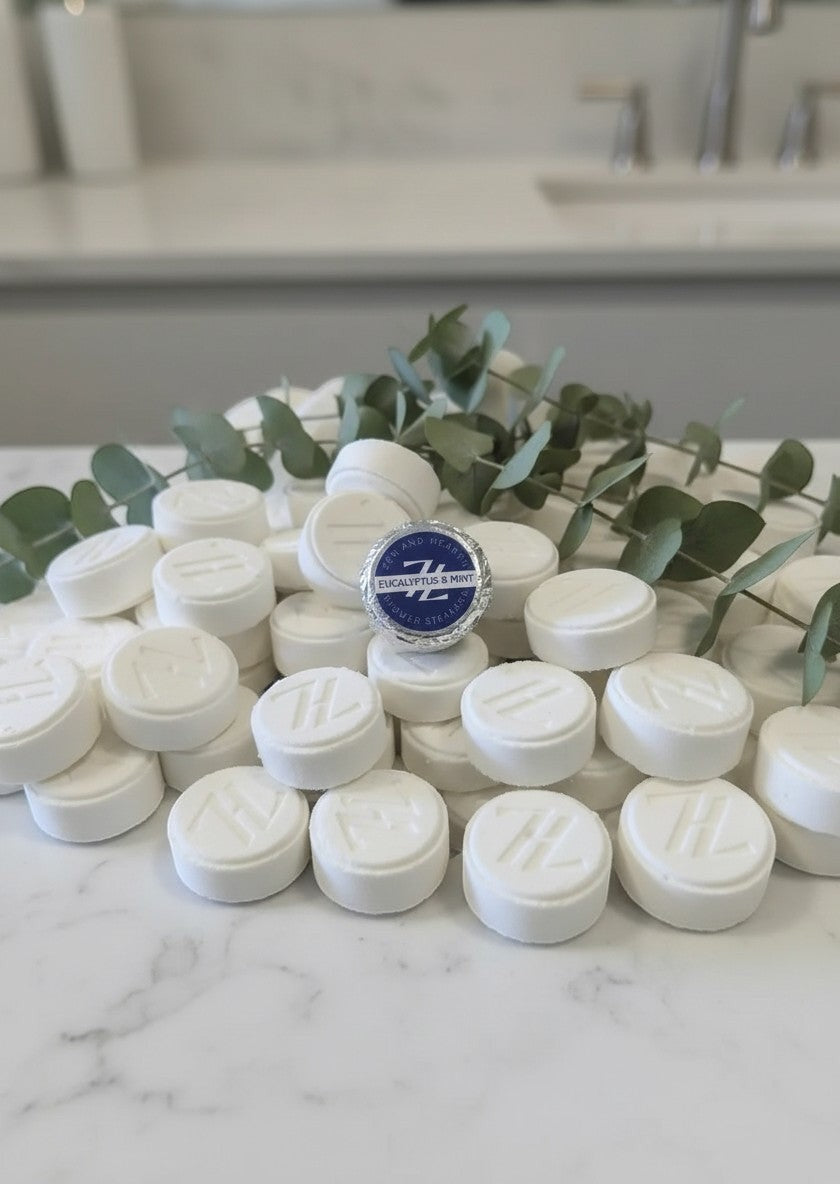 Oh Canada Gifts Zen & Hearth eucalyptus and mint shower steamers, white aromatherapy tablets with eucalyptus sprigs.