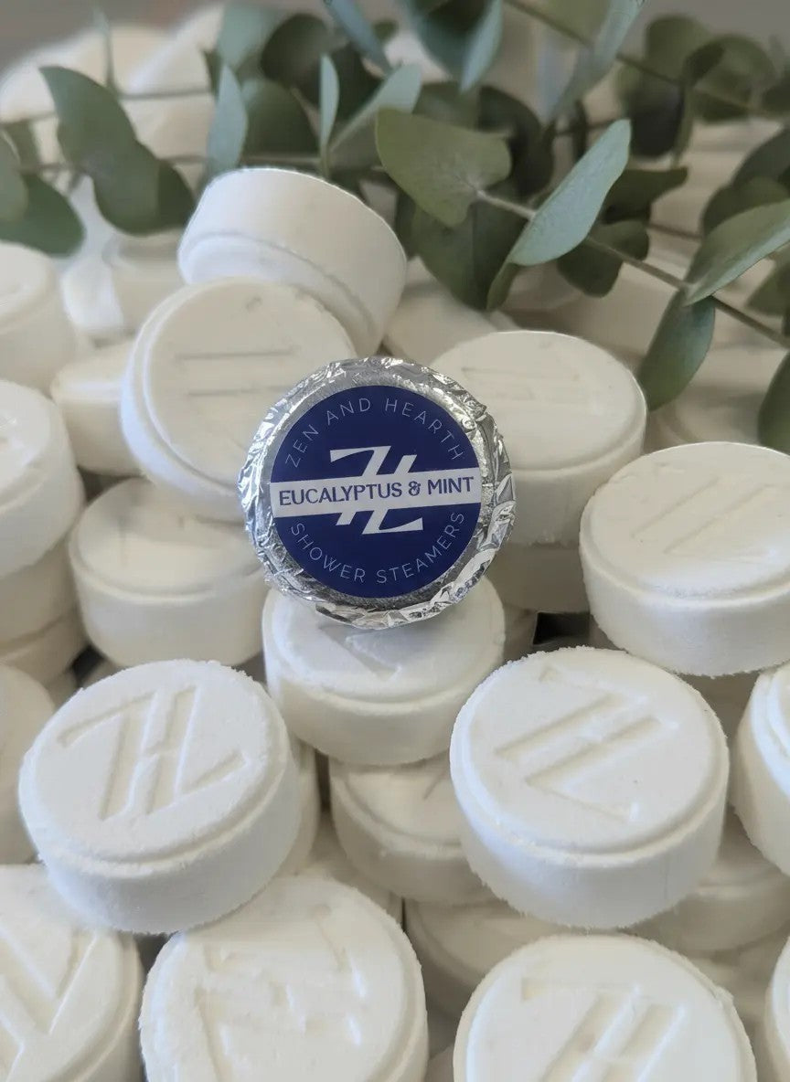 Oh Canada Gifts Zen & Hearth eucalyptus and mint shower steamers, white aromatherapy tablets with embossed logo.