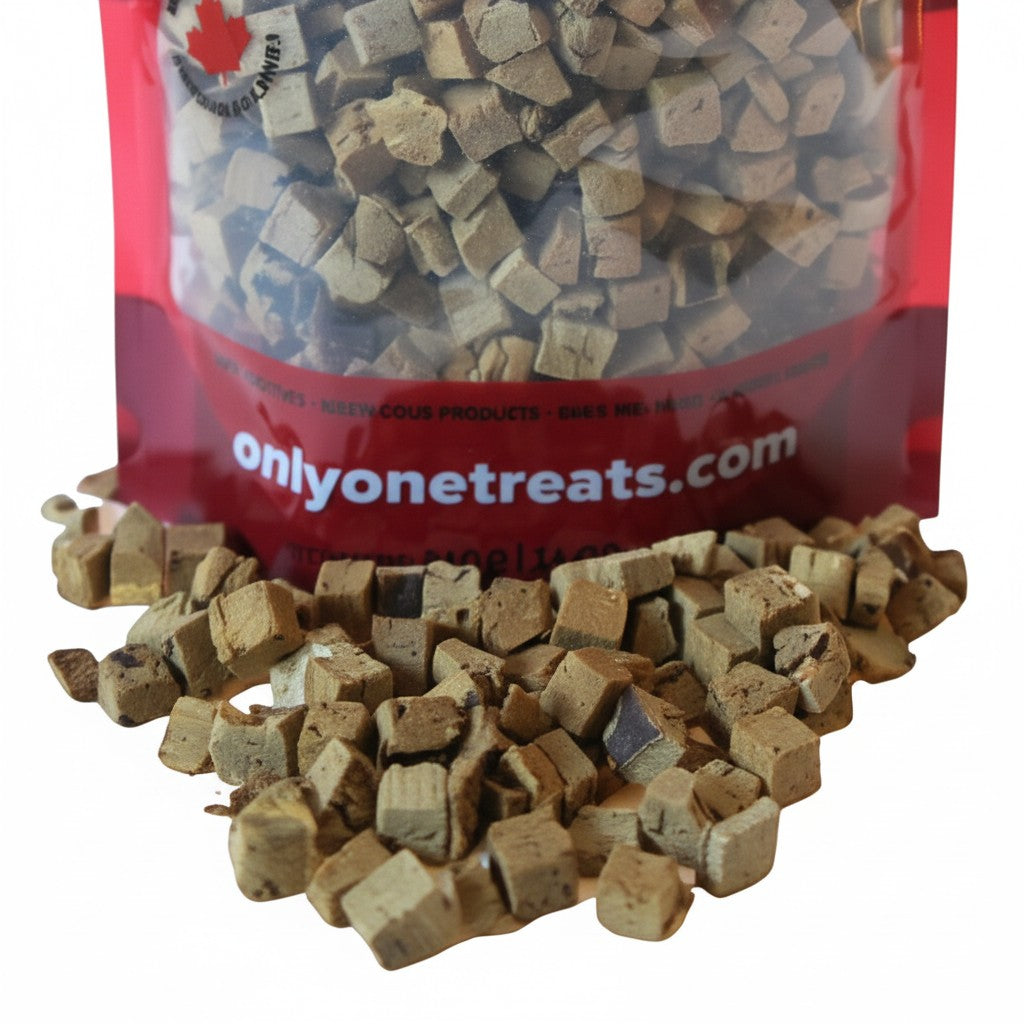 Oh Canada Gifts freeze-dried beef liver pet treats in a bulk bag with small, cubed pieces spilled in front.