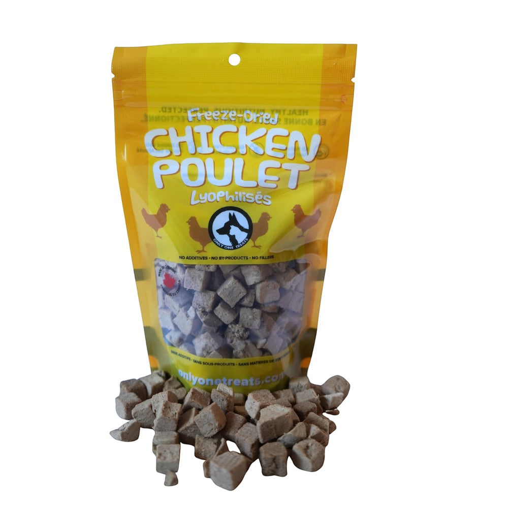 Oh Canada Gifts freeze-dried chicken treats in a yellow resealable bag with small meat cubes in front.