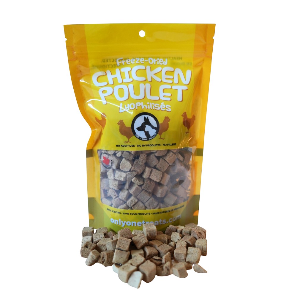 Oh Canada Gifts freeze-dried chicken pet treats in a yellow resealable bag with small cubed pieces in front.