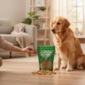 Oh Canada Gifts freeze-dried turkey pet treats in a green bag with a golden retriever waiting for a snack