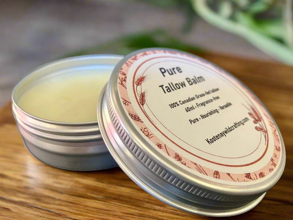 Oh Canada Gifts pure grass-fed Canadian tallow balm in a round metal tin on a wooden surface