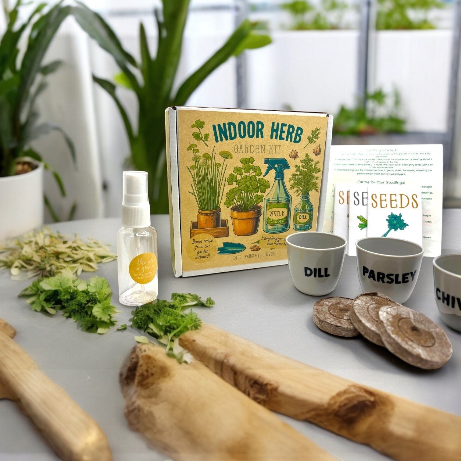 Oh Canada Gifts indoor herb garden starter kit with seeds, pots, soil pods, and water spritzer on a table