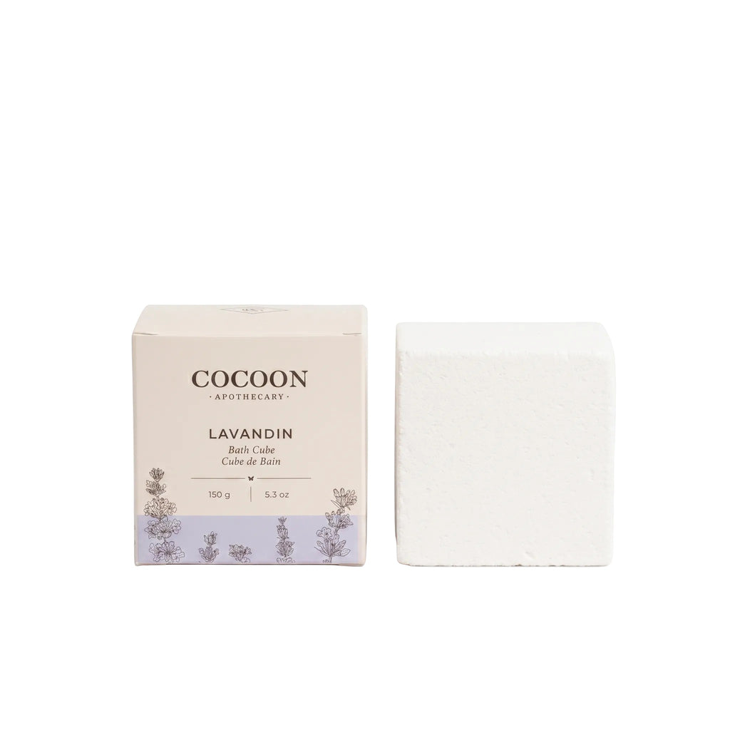 Oh Canada Gifts Lavandin Bath Cube in white packaging with botanical illustrations, next to a single white bath cube.