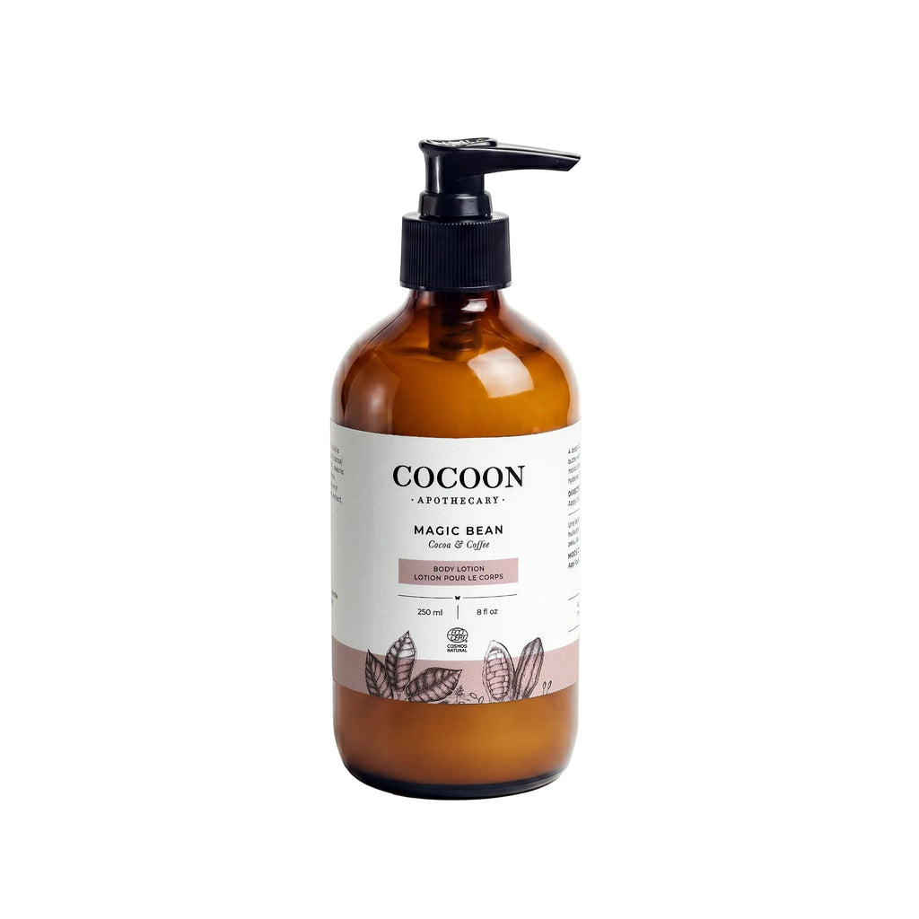 Oh Canada Gifts Magic Bean body lotion in an amber glass bottle with a black pump dispenser and botanical label.