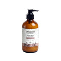 Oh Canada Gifts Magic Bean body lotion in an amber glass bottle with a black pump dispenser and botanical label.