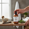 Oh Canada Gifts Malechemy plant-based shaving cream in a 250ml amber bottle on a rustic wooden table with shaving tools.