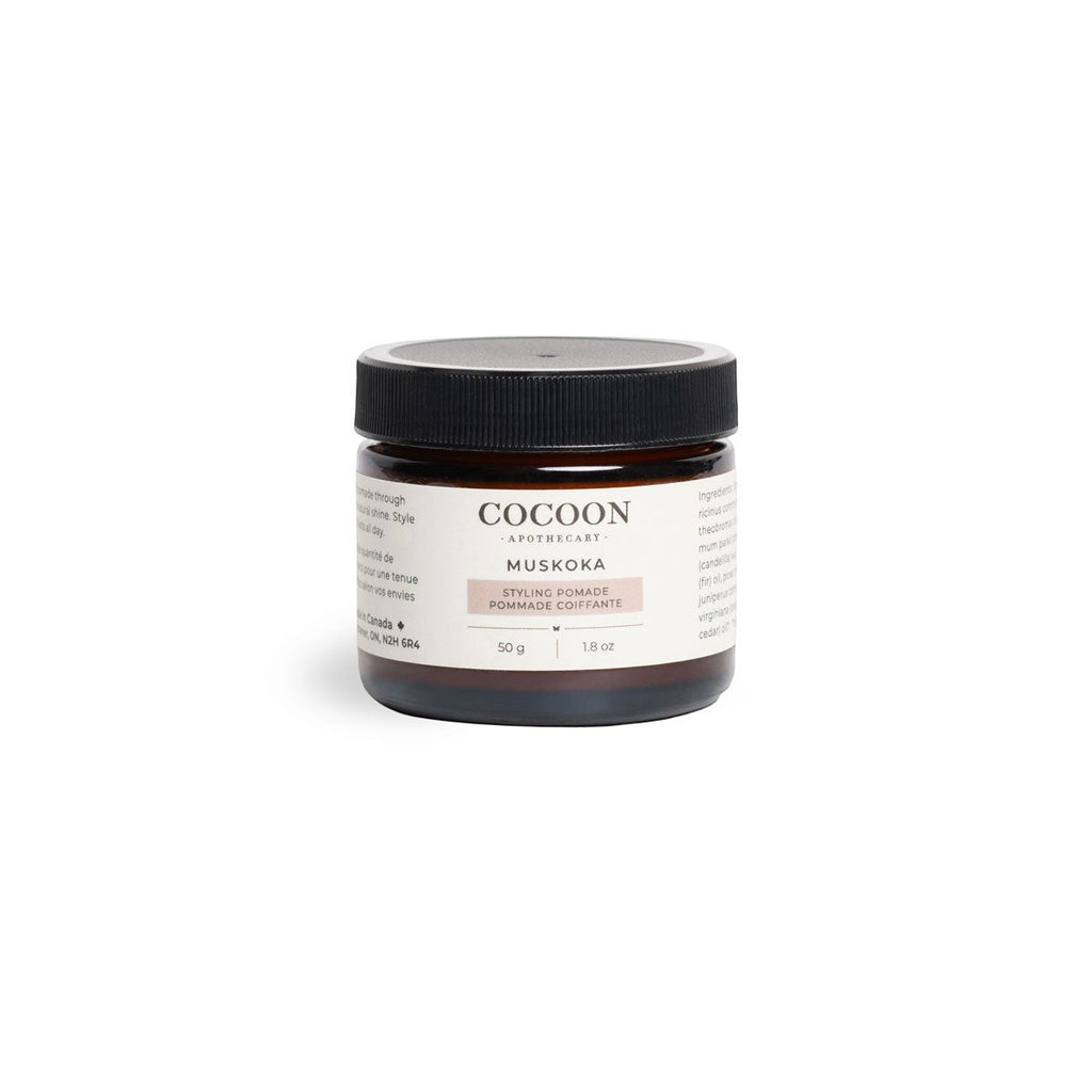 Oh Canada Gifts Muskoka Styling Pomade in a brown glass jar with a black lid, featuring a plant-based formula.