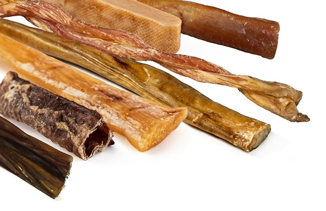 Oh Canada Gifts Ultimate Chew Box featuring a variety of natural Canadian-made dog chews like trachea and tendon sticks.