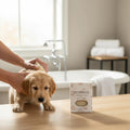 Oh Canada Gifts neem oil pet shampoo bar next to a golden retriever puppy being washed in a bright bathroom