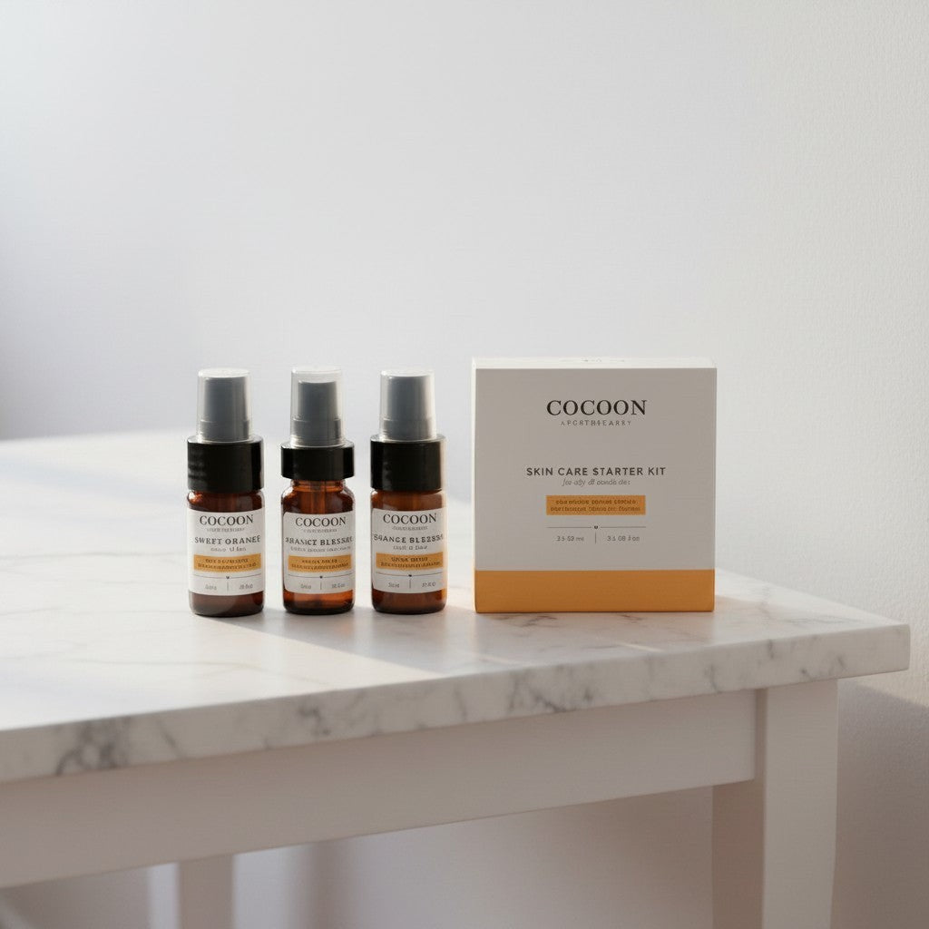 Oh Canada Gifts Cocoon Apothecary oily skin starter kit with three travel-size bottles and a box on a marble table.