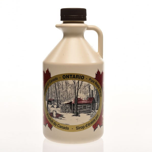 Oh Canada Gifts organic maple syrup in a lightweight plastic jug with a label featuring an Ontario sugar shack scene.