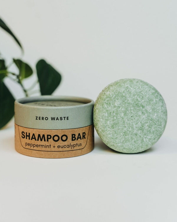 Oh Canada Gifts peppermint and eucalyptus zero-waste shampoo bar in a round cardboard container on a white background.