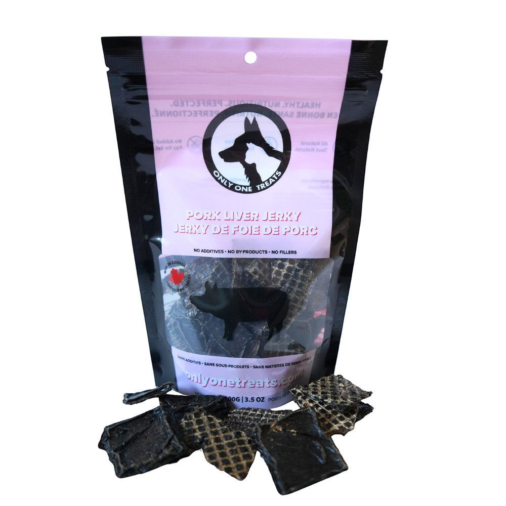 Oh Canada Gifts pork liver jerky dog treats in a 100g bag with dark, chewy, protein-rich pieces on a white background.