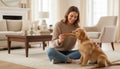 Oh Canada Gifts natural pork skin roll dog chew being fed to a golden retriever puppy by a woman in a living room