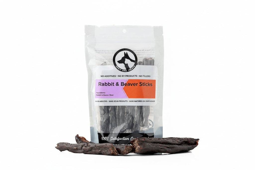 Oh Canada Gifts air-dried rabbit and beaver dog treat sticks in a clear plastic bag on a white background.