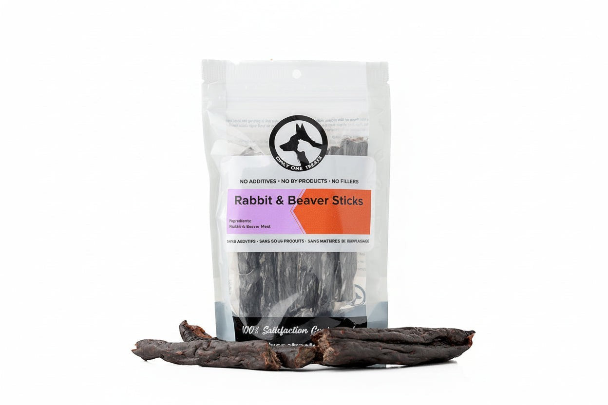 Oh Canada Gifts air-dried rabbit and beaver dog treat sticks in a clear plastic bag on a white background.