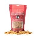Oh Canada Gifts Wild Pacific Salmon soft training treats in a red resealable bag with square biscuit pieces.