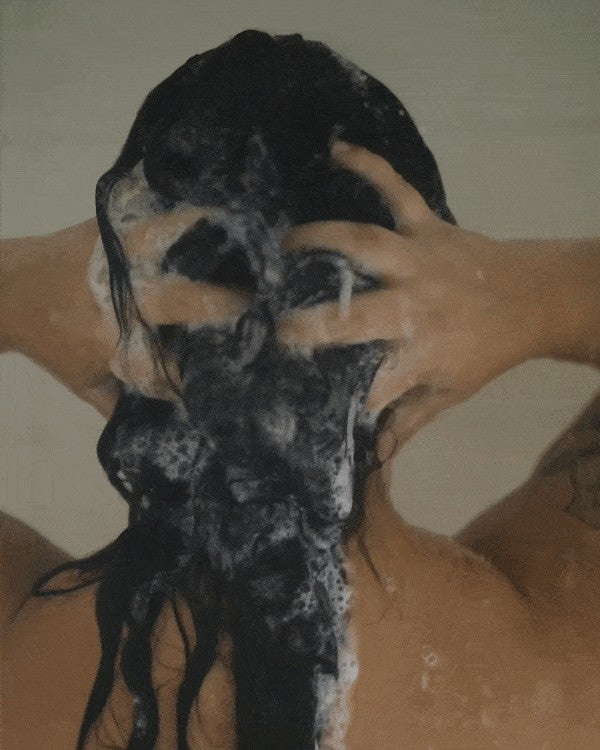 Oh Canada Gifts hair care duo shampoo bar lathering on a person's scalp in the shower for a sustainable hair routine