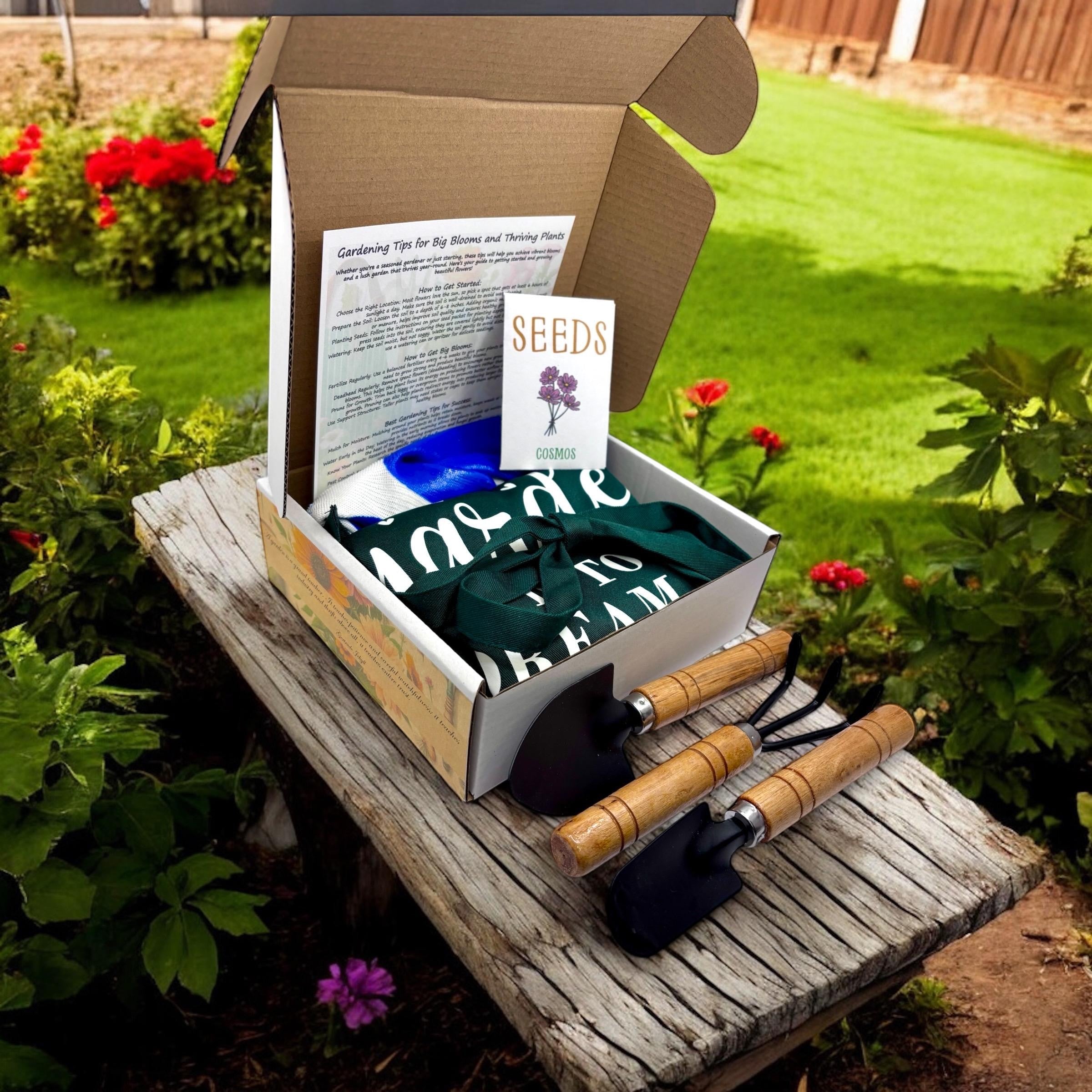 Oh Canada Gifts spring garden starter kit with cosmos seeds, green apron, and 3-piece wooden handle tool set in a box