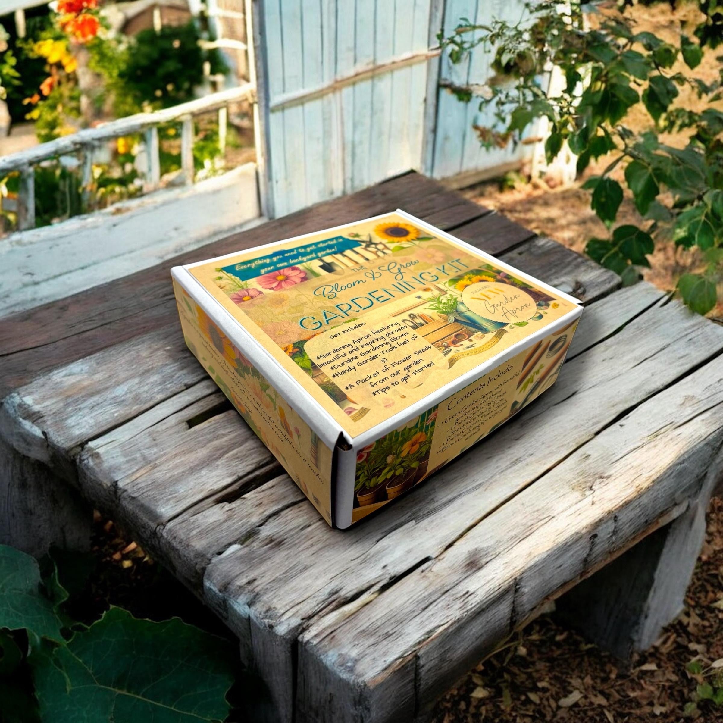 Oh Canada Gifts Spring Garden Starter Kit box featuring cosmos flower illustrations on a rustic wooden garden table.