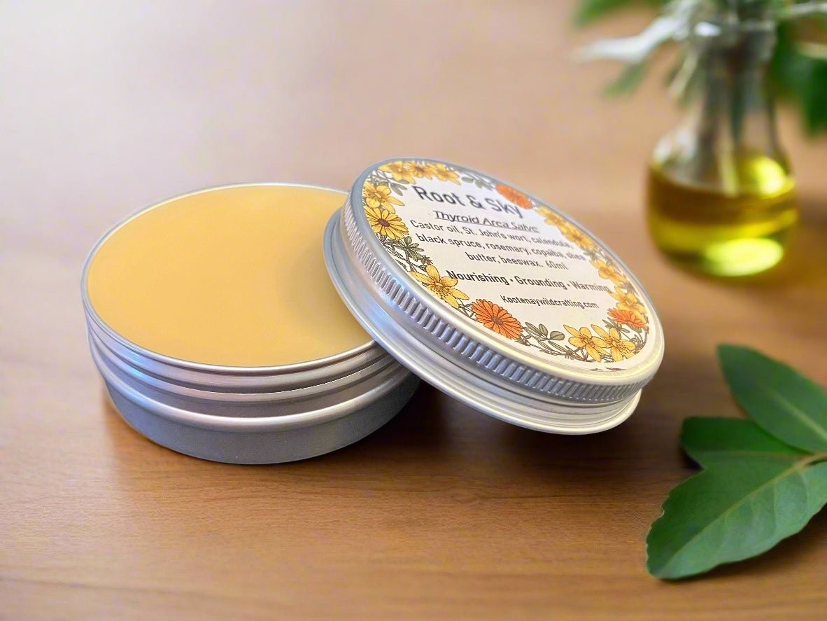 Oh Canada Gifts Root & Sky throat and neck salve in a small metal tin with a floral label on a wooden surface.