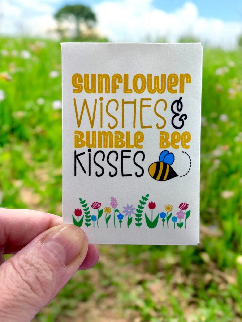 Oh Canada Gifts wildflower seed package with Sunflower Wishes and Bumble Bee Kisses text and floral illustration.